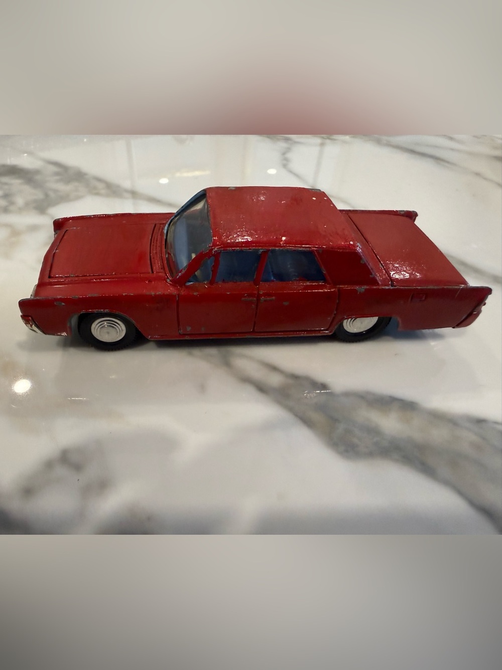 Vintage 1960s red model car of a Dinky Toys  Lincoln Continental